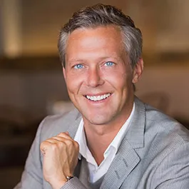 Professional man in grey suit smiling