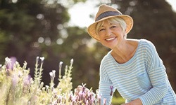 Woman in straw hat gardening
