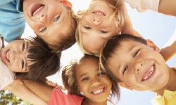 A group of children smiling.