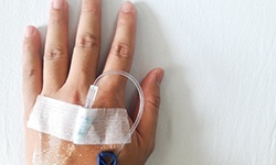 Close-up of patient’s hand with IV in it