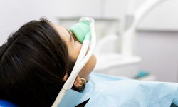 Patient wearing nasal mask for nitrous oxide