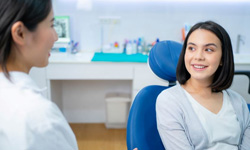 Patient and dental team member engaged in conversation