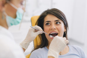 Woman receiving periodontal charting