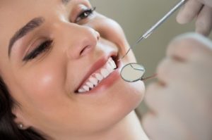 Woman getting dental cleaning