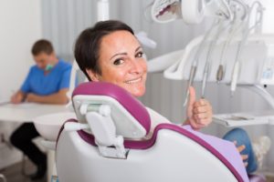 thumbs up from dental patient