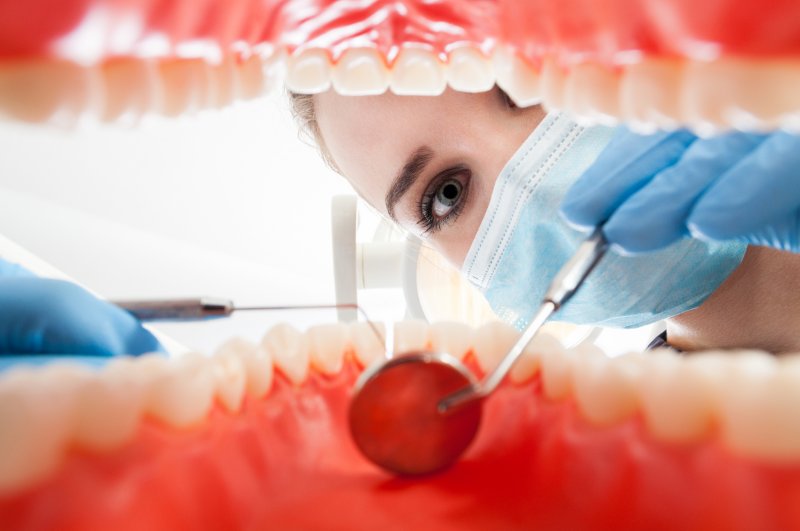 A dentist performing an exam.