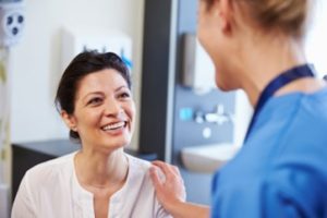 Patient visiting her dentist for a gum graft consultation.