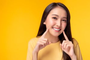 Woman with beautiful smile after gum disease therapy