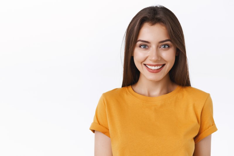 person smiling after having soft, spongy gums treated