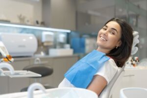Happy dental patient viewed from the side