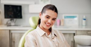 Smiling, relaxed dental patient in treatment chair 